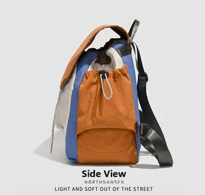 Side view of multi-color block vintage college style waterproof nylon backpack