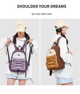 Detail of minimalist backpack showing drawstring decoration and adjustable shoulder straps