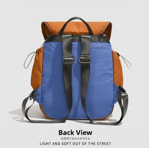 Back view of a color-block preppy backpack with adjustable straps and side pockets