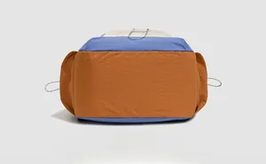 Detail view of the durable nylon bottom with tricolor patchwork and drawstring cords