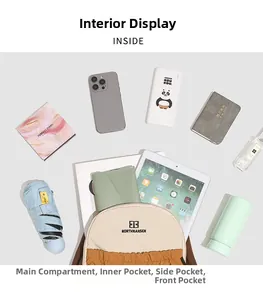 Detailed view of the spacious internal compartments showing laptop and daily essentials