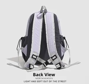Back view of the water-resistant purple backpack showing ergonomic S-shaped straps