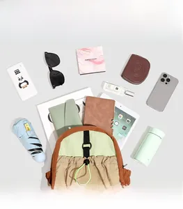 Interior storage space of the color-block backpack showing compartments with daily essentials