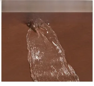 Close-up of waterproof brown fabric texture with water droplets on backpack surface