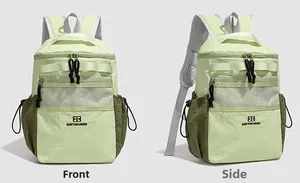 Detailed view of light green water-resistant nylon backpack with front mesh pocket