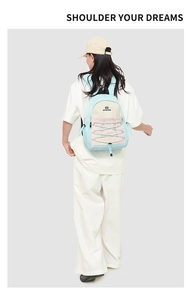 Detail showing color block backpack with drawstring design and Northkarsen brand logo