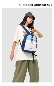 Detail of the water-resistant nylon material and orange drawstring on the casual backpack