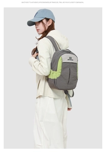 Vue latérale du sac à dos multifonctionnel avec design color-block gris et vert