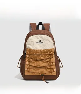Detail of outdoor backpack with tri-color nylon fabric and front elastic bungee cords