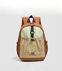 Front view of color-block casual backpack with drawstring pocket and water-resistant fabric