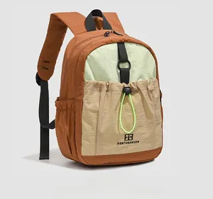 Detail shot of multicolor contrast backpack with drawstrings and textured nylon fabric