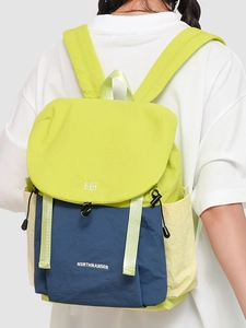 Waterproof nylon backpack with contrast green and navy blue design and drawstring closure