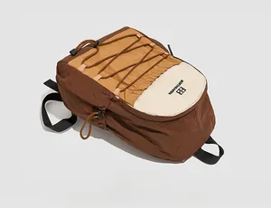 Detail of multi-color nylon backpack with cross elastic cords and Northnansen logo