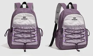 Detail view showing front and side of purple nylon outdoor backpack with elastic cords