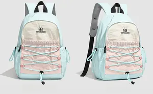 Detail of color-block backpack with blue bungee cords and textured nylon fabric finish