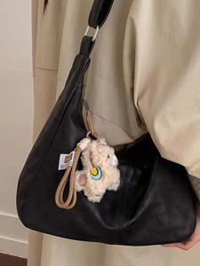 Vintage black faux leather tote bag with cute lamb plush charm for women's daily commute