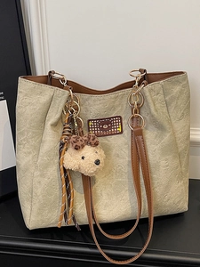 Large capacity beige tote bag with embossed bear patterns and plush teddy charm pendant