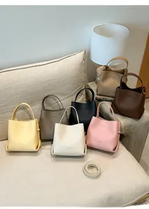 Multi-color collection of pebble leather bucket bags with detachable shoulder straps