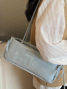 Minimalist light blue rectangular shoulder bag with long dual straps and fashion logo detail