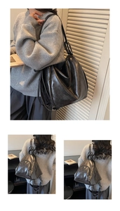 Detail of dark grey oil-wax leather tote showing texture and versatile adjustable straps