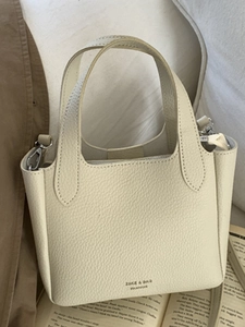 Chic cream white pebble leather tote bag with sturdy top handles for stylish women