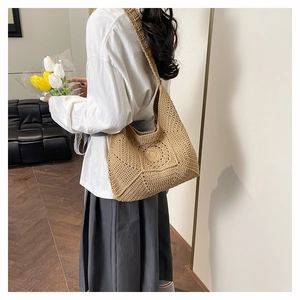 Close-up of bohemian crochet shoulder bag with circular mandala hollow flower pattern
