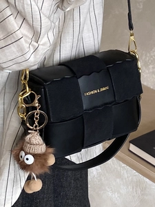 Vintage black crossbody bag with woven wave pattern and cute plush doll pendant