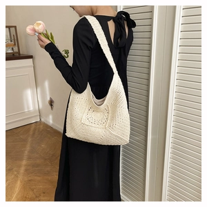 Detail of bohemian cream cotton crochet tote bag with hollow flower patterns and lining