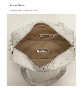 Detail view showing the spacious interior compartment and zippered pocket of the star tote bag