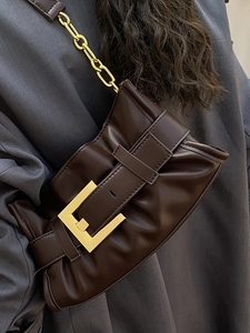 Chic dark brown pleated shoulder bag with oversized gold buckle and chain strap