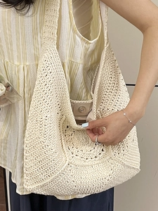 Bohemian off-white crochet shoulder bag with floral knit pattern and magnetic closure