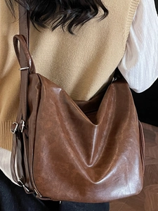 Minimalist dark brown pleated hobo tote bag for women with adjustable strap and large capacity