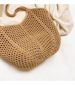 Detail view of khaki handmade crochet tote bag featuring intricate diamond hollow patterns