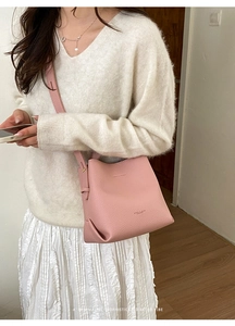 Close-up of pink litchi texture leather bucket bag with Love & Bag Fashion logo