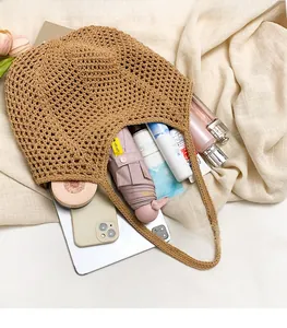 Detail showing the spacious interior of the woven tote bag with daily essentials inside
