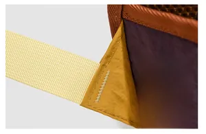 Detailed close-up showing bartack reinforced stitching on purple and yellow nylon backpack