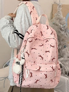 Pink bow-patterned school backpack for girls with cute rabbit plush keychain