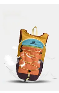 Lightweight outdoor travel backpack with colorful patchwork nylon and elastic cord system