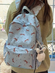 Light blue bow tie pattern school backpack with wave texture and plush rabbit keychain