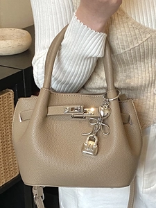 Classic taupe lychee leather mini bucket bag with fashion charms and silver hardware