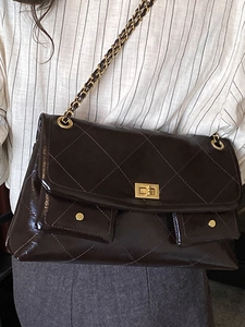 Quilted coffee brown shoulder bag with gold chain strap and double front pockets