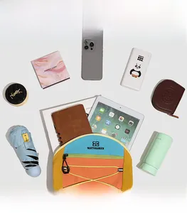 Internal storage detail of colorful drawstring backpack with gadgets and tablet
