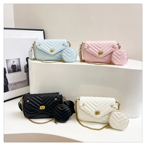 Close-up of elegant V-quilted chain bags with metallic twist locks in four vibrant colors