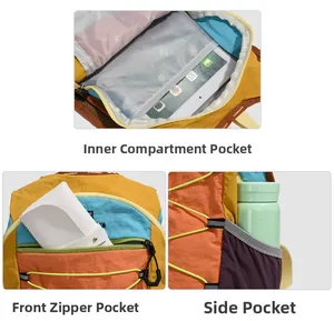 Detail of color-block backpack showing padded laptop sleeve and front zip pocket