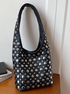 Black leather hobo bag with silver metallic studs and vintage punk motorcycle style