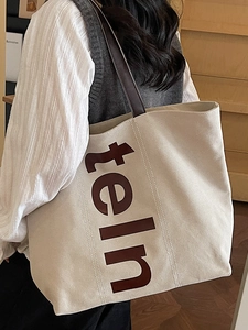 Grand sac cabas en toile beige avec anses brunes et imprimé lettre pour le quotidien