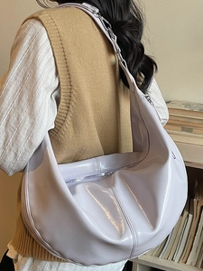 Glossy light purple hobo shoulder bag in crescent shape with wide strap for women