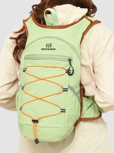 Green outdoor hiking backpack with drawstring detail and NORTHNANSEN logo for women