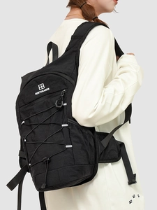 Women's black travel backpack with drawstring design and elastic cords for outdoor sport