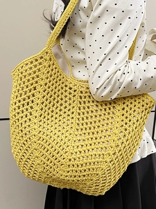 Bright yellow hand-woven crochet tote bag with hollow design and inner lining